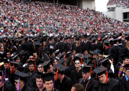 Shelby Lum / Photo editor OSU students stand with their colleges at the OSU Spring Commencement on May 5 at Ohio Stadium.