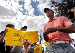 Courtesy of MCT Tiger Woods signs autographs before The Master at Augusta National Golf Club in Augusta, Ga., on April 9