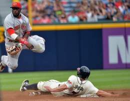 Cincinnati Reds second baseman Brandon Phillips throws to first base after forcing out the Atlanta Braves' Reed Johnson (7) in the eighth inning at Turner Field in Atlanta, Georgia, on Saturday, July 13, 2013. The Braves won, 5-2. 