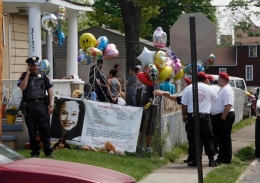 Police guard Gina DeJesus’ house in Cleveland May 7. DeJesus, Amanda Berry and Michelle Knight were found May 6 a few blocks away from where they went missing about a decade ago in Cleveland.