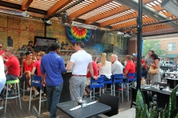 People gather at the Union Cafe in Columbus June 26 for a "DOMA is Dead" celebration after the US Supreme Court's ruling to overturn DOMA.
