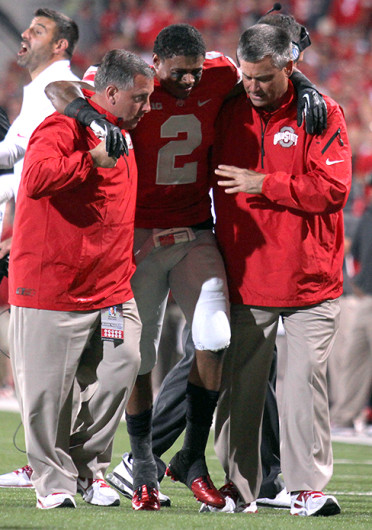 Senior safety Christian Bryant (2) is helped off the field after breaking his ankle during a game against Wisconsin Sept. 28 at Ohio Stadium. OSU won, 31-24. Credit: Shelby Lum / Photo editor