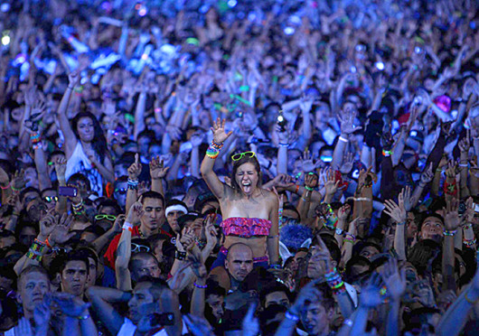 Ravers dance during a set by DJ Porter Robinson during the 2nd day of the Electric Daisy Carnival at the Las Vegas Motor Speedway in Las Vegas June 25, 2011. 