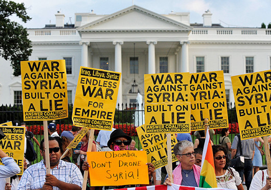 Demonstrators rally on the north side of the White House in Washington, D.C., to protest any US military action against Syria Aug. 29.