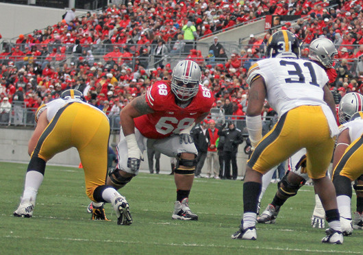 Sophomore right tackle Taylor Decker (68) gets set to block a defender during a game against Iowa Oct. 19 at Ohio Stadium. OSU won, 34-24. Credit: Shelby Lum / Photo editor