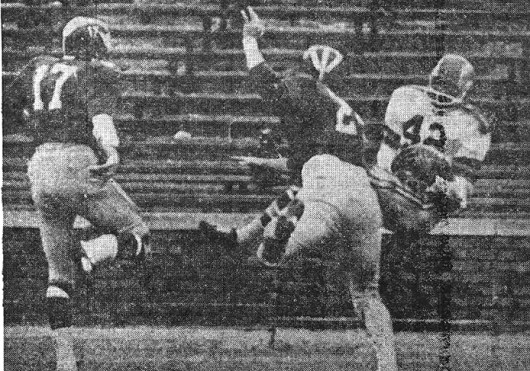 OSU running back Paul Warfield (42) catches a 35-yard pass from quarterback Don Unverferth late in the second quarter for a touchdown against Michigan Nov. 30, 1963. OSU won, 14-10. Credit: AP wirephoto published by The Lantern Dec. 2, 1963