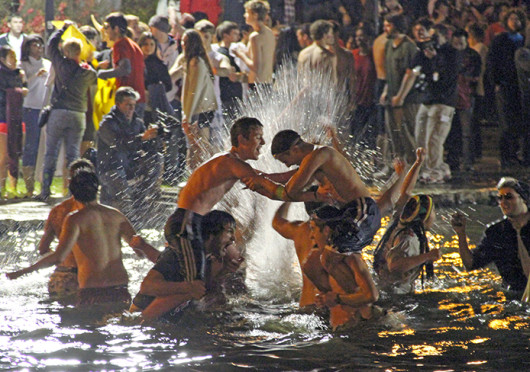 OSU students jump into Mirror Lake in 2011 as part of a Beat Michigan week tradition. This year’s jump is scheduled to take place Nov. 26. Credit: Lantern file photo