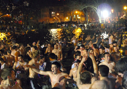 Ohio State fans jump in Mirror Lake.