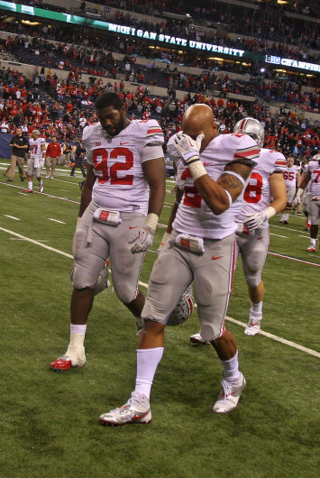 Junior linebacker Ryan Shazier (2) emotionally walks off the field after OSU lost against Michigan State, 34-24, in the Big Ten Championship game Dec. 8 at Lucas Oil Stadium. Credit: Shelby Lum / Photo editor
