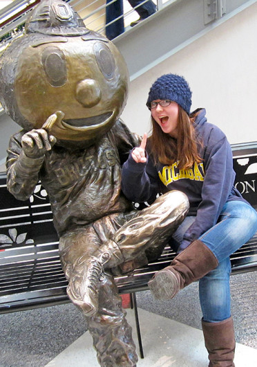 Posing with the Brutus Buckeye statue at the Ohio Union, Lantern reporter Kim Dailey spent her gameday during Rivalry Week posing as a Michigan fan on OSU’s campus.