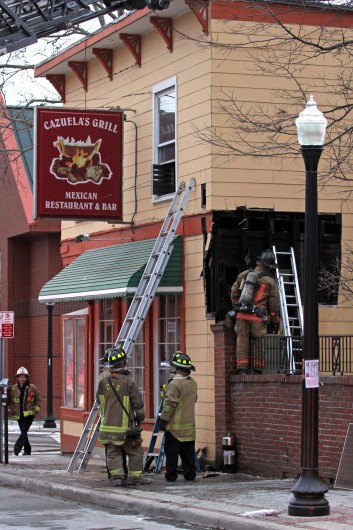 Firefighters work on a small fire at Cazuela's Grill that caused smoke damage Jan. 8. Credit: Ritika Shah / Asst. photo editor