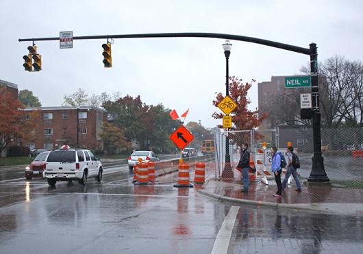 OSU students wait to cross the street at the corner of Lane and Neil avenues beside closed portions of Lane Avenue Oct. 31. Credit: Sam Harrington / Lantern photographer