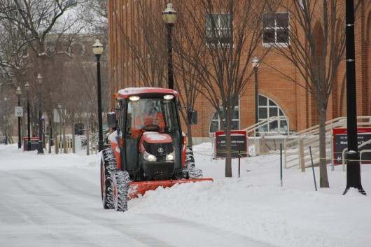 A snow plow drives through campus to clear the road Jan. 26. Classes were canceled at OSU's Columbus campus Jan. 28. Credit: Lantern file photo