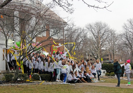 The Rho chapter of Alpha Phi, a women’s fraternity, pose for photos with new members on Bid Day Jan. 20 at the chapter’s house, located at 134 E. 15th Ave. Sororities and fraternities will be required to follow certain policies to participate in OSU’s second-year living program.<br />Credit: Shelby Lum / Photo editor