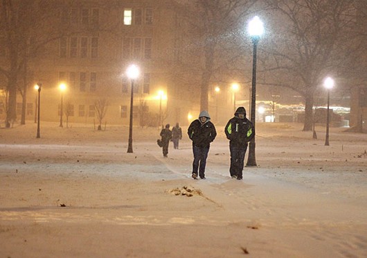 Students walk across a snowy Oval Feb. 4. Classes were canceled at OSU’s main and branch campuses Jan. 6, 7 and 28 because of cold weather. OSU officials later announced professors would have the option of making up  missed classes. Credit: Shelby Lum / Photo editor