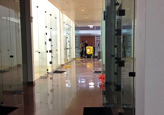 Court damage resulted from a sprinkler going off at the RPAC. A ball from a racquetball game hit the protective cover on a sprinkler head, causing it to go off and the RPAC to be evacuated Feb. 25. Credit: Shelby Lum / Photo editor