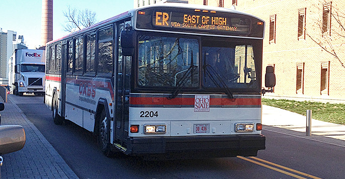 An East Residential CABS bus on 17th Avenue. Some students have noticed that buses have been overcrowded lately. Credit: Logan Hickman / Lantern photographer