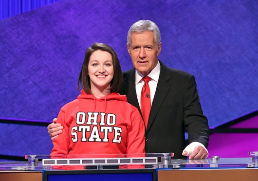 Maria Khrakovsky, fourth-year in accounting and French, poses with Alex Trebek. Credit: Courtesy of Jeopardy Productions, Inc.