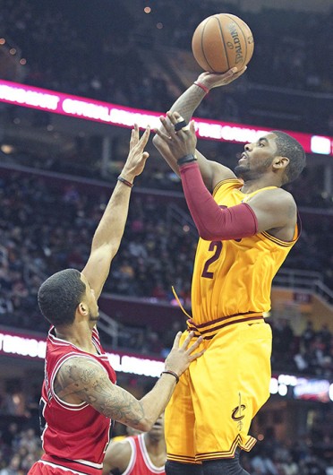 Cleveland Cavaliers guard Kyrie Irving attempts a shot during a game against the Chicago Bulls on Jan. 22 at Quicken Loans Arena. The Cavaliers lost, 98-87. Credit: Courtesy of TNS