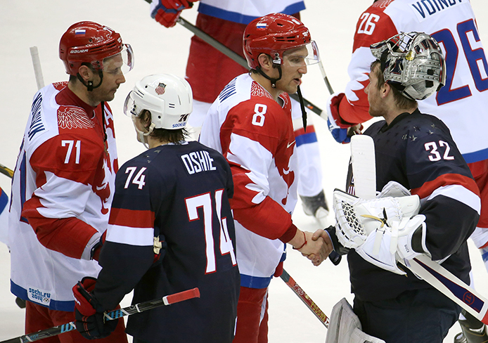Members of the Russia and USA Olympic hockey teams shake hands after a game at Bolshoy Ice Dome during the Winter Olympics in Sochi, Russia, Feb. 15.  USA won, 3-2. 
