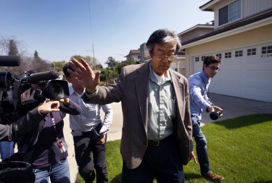 Journalists attempt to talk with Satoshi Nakamoto, who has been called the Bitcoin creator, as he walks from his home to a car March 6 in Temple City, Calif.  Credit: Courtesy of MCT