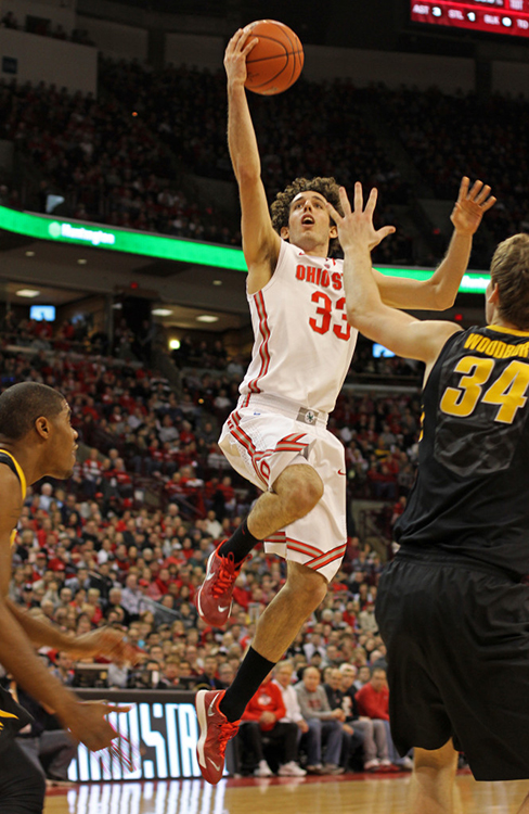 Sophomore guard Amedeo Della Valle (33) attempts a lay up during a game against Iowa Jan. 12 at the Schottenstein Center. OSU lost, 84-74.