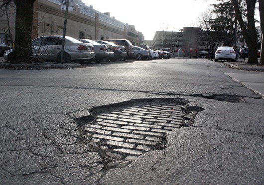 A pothole on OSU’s campus. This month, the Columbus Department of Public Service set its street maintenance crews to work in an effort to address the pothole problem that sprung up during this winter’s record-setting snowfall. <br />Credit: Alice Bacani / News director of Buckeye TV