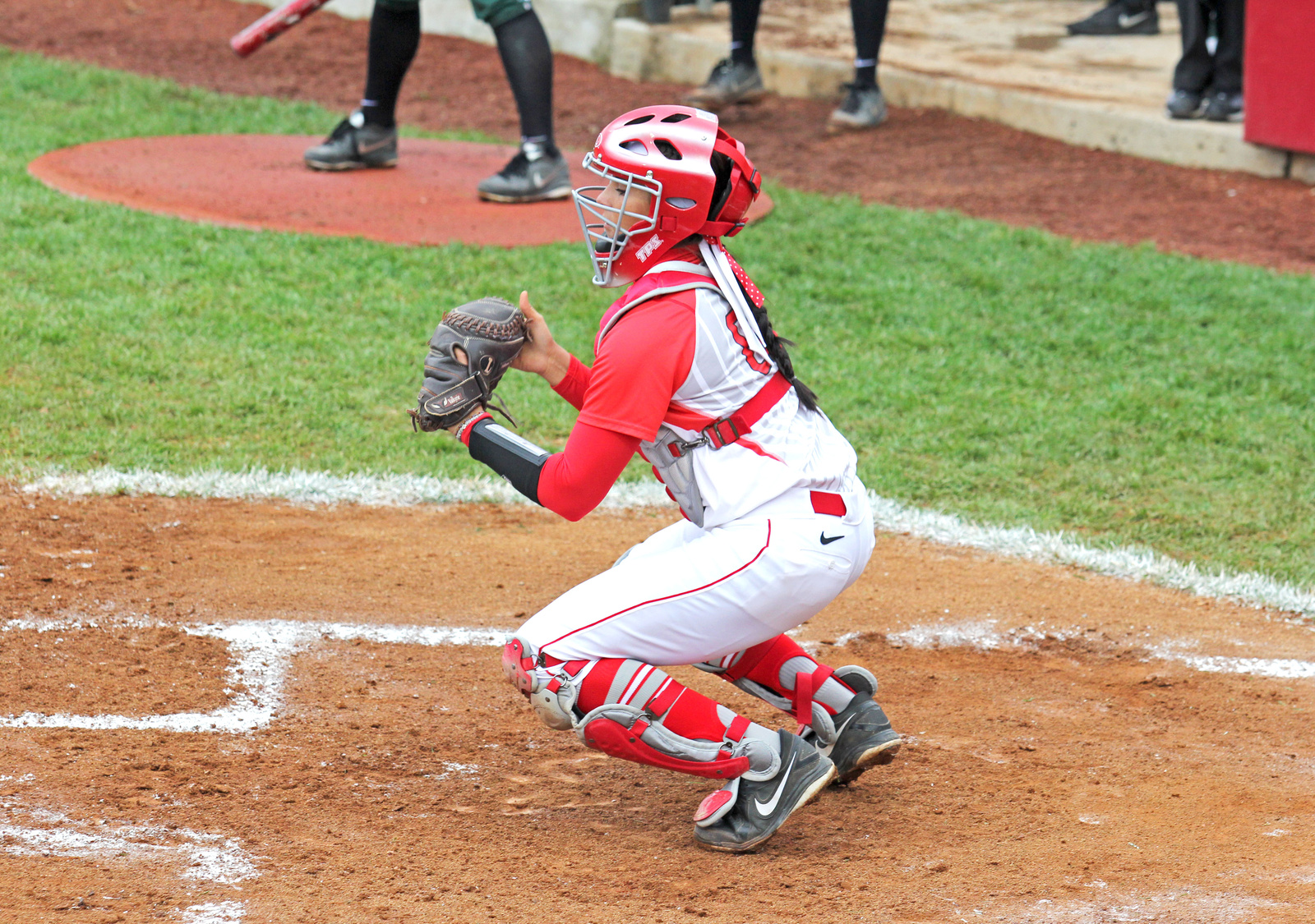 Then-junior catcher Melissa Rennie readies herself for a play during a game against Michigan State April 24, 2013, at Buckeye Field. OSU won, 6-3.