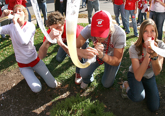 Wisconsin fans drink their beer bongs after a round of 'Drinko' before the Wisconsin football game on Oct.7, 2006. Credit: Courtesy of MCT