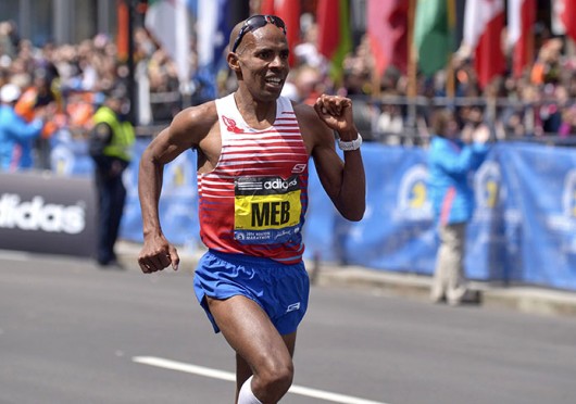 Meb Keflezighi wins the 118th Boston Marathon, a year after deadly bombings, near the Marathon finish line in Boston April 21. Keflezighi is the first American male to win since 1983. Credit: Courtesy of MCT