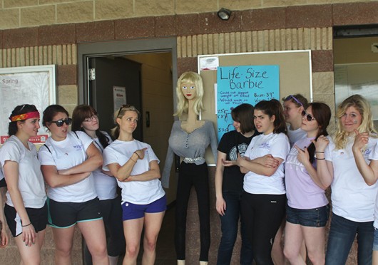 Members of the OSU Body Sense club pose for a photo with a representation of a life-sized Barbie. Credit: Francis Pellicciaro / Lantern reporter