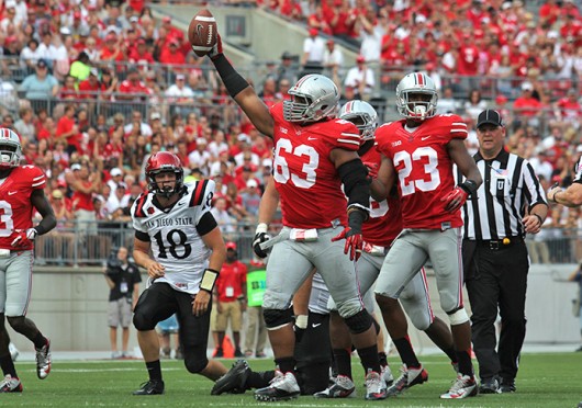 Then-junior defensive lineman Michael Bennett (63) celebrates recovering a fumble during a game against San Diego State Sept. 7 at Ohio Stadium. OSU won, 42-7. Credit: Lantern file photo