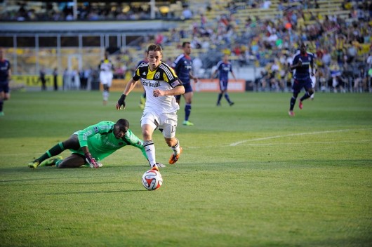 Columbus Crew midfielder Ethan Finlay dribbles past Chicago Fire goalie Sean Johnson during a game against the Fire May 24 at Crew Stadium in Columbus. The Crew won, 2-0. Credit: Courtesy of Crew Communications / Kirby Hines