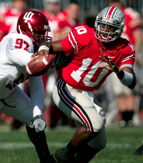 Ohio State quarterback Troy Smith (10) buys some time and eludes Indiana's Keith Burrus (97) in the second quarter of a football game, Saturday, Oct. 21, 2006 at the Ohio Stadium in Columbus, Ohio. Ohio State won the contest, 44-3. Credit: Courtesy of MCT