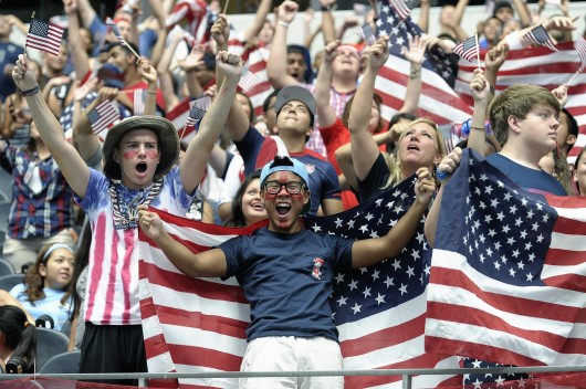 Justen Woody, left, and Robert Driskill both of Fort Worth, Texas, cheer at AT&T Stadium in Arlington, Texas, as soccer fans watch the World Cup soccer match between the USA and Belgium on July 1. Belgium advanced, 2-1, in extra time. Credit: Courtesy of MCT
