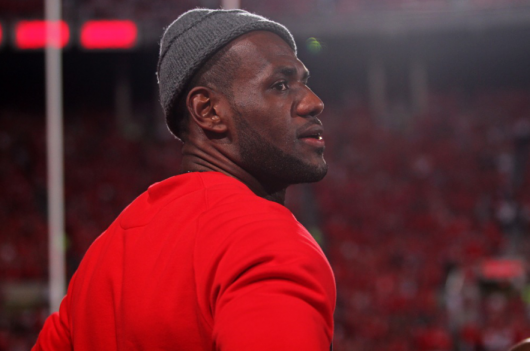 2013 NBA Champion for the Miami Heat and Akron, Ohio native LeBron James stands on the sidelines at the Wisconsin football game Sept. 28 at Ohio Stadium. OSU won, 31-24. Credit: Lantern file photo