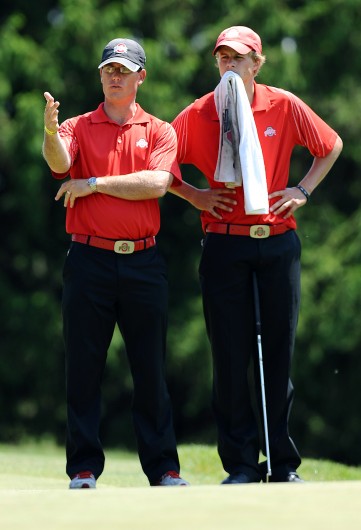 Former Ohio State assistant men's golf coach Ryan Potter (left) talks with a player during the second round of the NCAA Men's Golf Central Regional at the University of Michigan Golf Course in Ann Arbor, Mich., May 18th. Credit: Courtesy of OSU Athletics