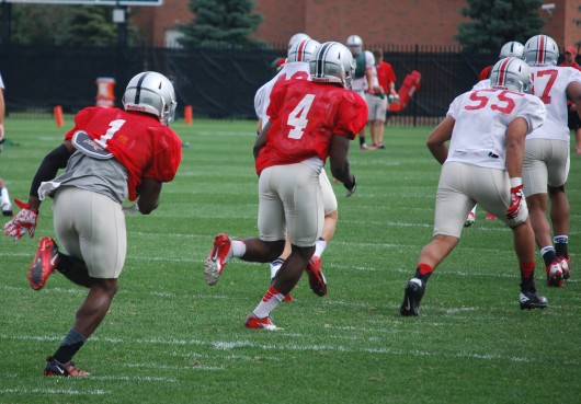 OSU freshman wide reciever Johnnie Dixon (1) practices kick-return duties while freshman running back Curtis Samuel (4) and junior linebacker Cam Williams (55) block during fall camp at the Woody Hayes Athletic Center Aug. 6 in Columbus. Credit: Tim Moody / Lantern sports editor