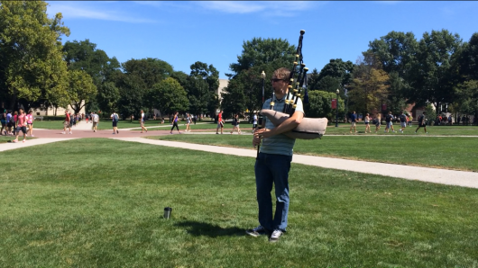 Josh Whitson, the OSU student immigration coordinator, plays the Great Highland bagpipe on the Oval Aug. 29. Credit: Liz Young / Editor-in-chief