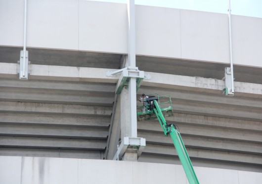 A construction worker works on a lift outside of Ohio Stadium Aug. 28.  Credit: Tim Moody / Sports editor