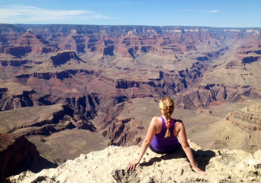 Caitlin Essig, a fourth-year in journalism, sits at the Grand Canyon this summer. Credit: Courtesy of Caitlin Essig