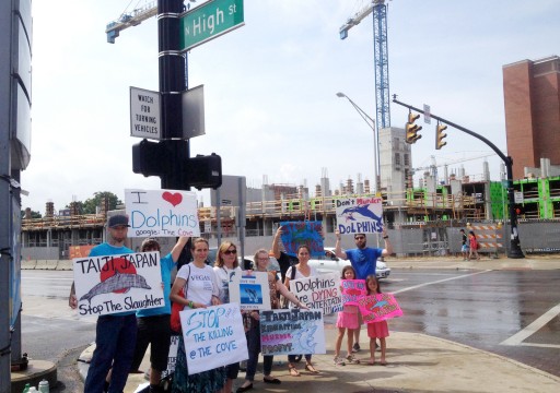 A group of protesters gather on the corner of Lane Avenue and High Street near OSU campus Sept. 1 to raise awareness about dolphin killings in Japan. Credit: Mark Batke / Photo editor