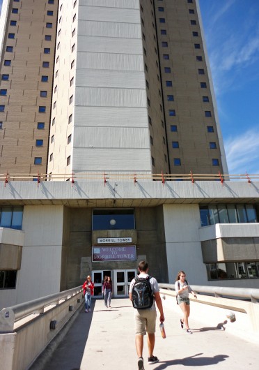 Student enter and exit Morrill Tower. The building is undergoing repairs to its third floor roof. Credit: Hayley Beck / Lantern reporter