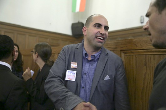 Professor Steven Salaita talks with a member of the press on Sept. 9 in Urbana, Ill. Salaita was fired from the University of Illinois after he posted tweets about Israeli attacks in Gaza.  Credit: Courtesy of MCT