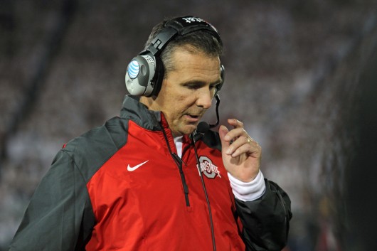 OSU coach Urban Meyer talks into his headset on the sidelines during a game against Penn State on Oct. 25 in State College, Pa. OSU won, 31-24, in double overtime. Credit: Ritika Shah / Lantern TV news director
