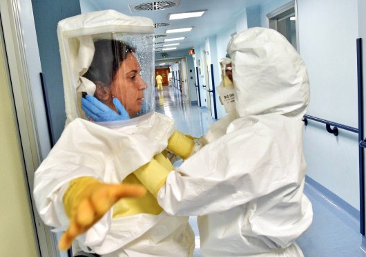 Medical staff wear protective suits as an isolation ward is prepared at Sacco hospital in Milan, Italy Oct. 22 in readiness for any potential Ebola outbreak. Credit: Courtesy of TNS