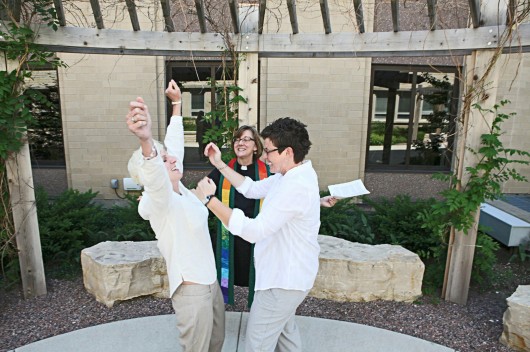 Rev. Suzelle Lynch marries Karen Wells, right, and Kristie Erickson in a ceremony outside the Waukesha County Courthouse on June 9 in Waukesha, Wis. Credit: Courtesy of MCT