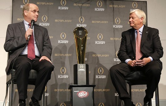 Bill Hancock, executive director of the College Football Playoff and Tommy Bain, chairman of the Stadium Events Organizing Committee speak at a press conference to announce the events surrounding the National Championship game at AT&T Stadium in Arlington, Texas, Aug. 29. Credit: Courtesy of MCT