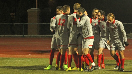 Members of the OSU men’s soccer team celebrate a goal from junior defender Kyle Culbertson (3) during a match against Akron on Nov. 20 at Jesse Owens Memorial Stadium. OSU advanced on penalty kicks, 1-1 (13-12).  Credit: Emily Yarcusko / For The Lantern