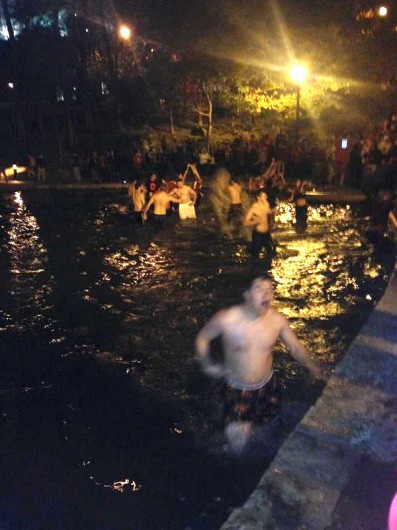 Students jump into Mirror Lake during the early morning hours of Nov. 9, shortly following OSU's 49-37 victory over Michigan State in East Lansing, Mich.  Credit: Courtesy of Courtesy of Reid Stephan
